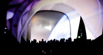 In the vestibule, just before the curtain raises, to reveal the Space Shuttle Atlantis.